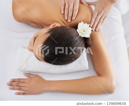 Woman, back massage and spa treatment for relaxing, wellness and physical therapy for body care. Top view, hands and nudity of female person on bed, beauty and resting for skincare and peace or zen Woman, back massage and spa treatment for relaxing, wellness and physical therapy for body care. Top view, hands and nudity of female person on bed, beauty and resting for skincare and peace or zen 139809638