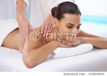 Spa, massage and wellness of a woman, vacation or weekend break with health therapy for stress relief. Hands for body care, relaxing or skin session of a customer feeling calm or happiness with peace 139809695