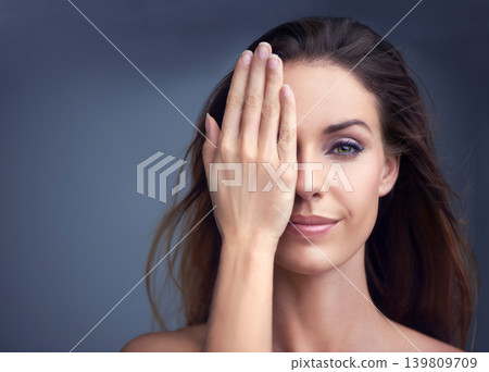 Makeup, smile and hand on face of woman in studio for beauty, comparison or makeover on grey background. Half, portrait and female model with glowing skin, wellness or glamour treatment results Makeup, smile and hand on face of woman in studio for beauty, comparison or makeover on grey background. Half, portrait and female model with glowing skin, wellness or glamour treatment results 139809709