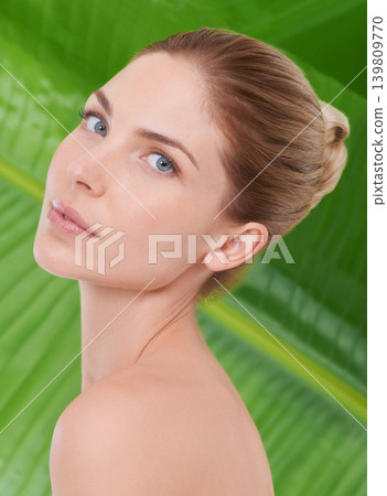 Woman, beauty and portrait with leaves, palm tree and sustainability for organic cosmetics. Girl, person or model with plants for wellness, transformation or glow with dermatology for facial skincare 139809770