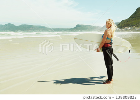 Portrait, smile and woman with surfboard at beach on space for sports, travel or hobby in summer. Fitness, surfing and vacation with happy young person on tropical coast for holiday or island getaway Portrait, smile and woman with surfboard at beach on space for sports, travel or hobby in summer. Fitness, surfing and vacation with happy young person on tropical coast for holiday or island getaway 139809822