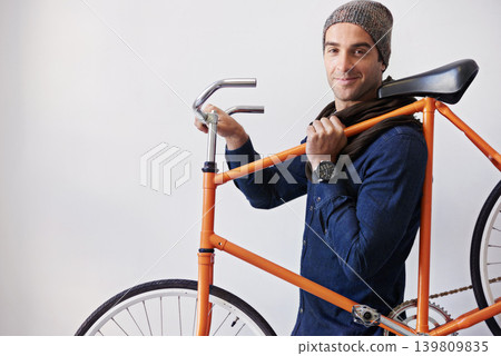 Man, studio and bike for eco friendly, portrait and transportation on white background. Hipster cyclist, carbon neutral and sustainability travel for environmental commute or fitness and trip 139809835