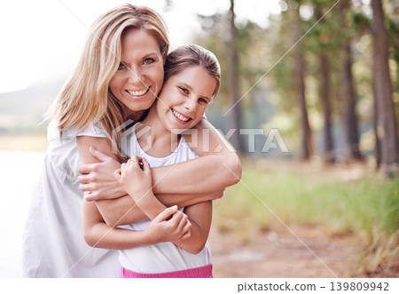 Mother, daughter and portrait in forest with happiness for bonding, support and hug on holiday in nature. Family, woman and girl child with face, smile and embrace on vacation, travel and adventure Mother, daughter and portrait in forest with happiness for bonding, support and hug on holiday in nature. Family, woman and girl child with face, smile and embrace on vacation, travel and adventure 139809942