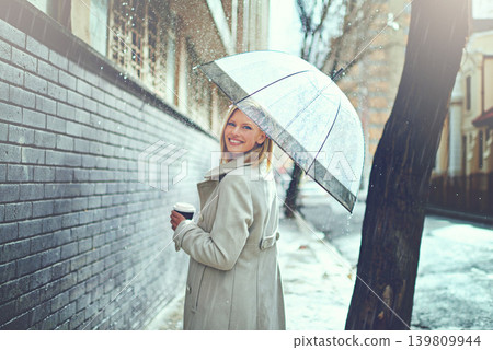 Woman, umbrella and coffee in street with portrait, smile and walking for commute in winter in city. Person, trench coat and outdoor for fashion on metro road with coco, tea cup or happy in Cape Town 139809944