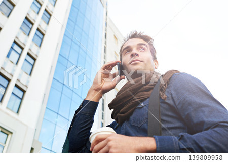 Man, smartphone and smile in city for phone call, conversation or networking in Los Angeles. Male person, technology and confidence with communication, contact and happy in morning from low angle Man, smartphone and smile in city for phone call, conversation or networking in Los Angeles. Male person, technology and confidence with communication, contact and happy in morning from low angle 139809958