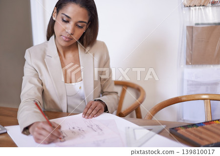 Tailor, woman and drawing on paper with pencil in startup office of small business. Creative, serious person or fashion designer sketch at desk for illustration, planning or project ideas for clothes Tailor, woman and drawing on paper with pencil in startup office of small business. Creative, serious person or fashion designer sketch at desk for illustration, planning or project ideas for clothes 139810017