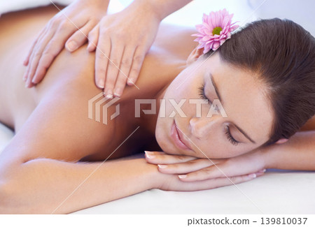 Luxury, massage and woman at spa for health, wellness and relax with calm holistic treatment. Self care, peace and girl on table with masseuse for body therapy, balance and hotel service hospitality. Luxury, massage and woman at spa for health, wellness and relax with calm holistic treatment. Self care, peace and girl on table with masseuse for body therapy, balance and hotel service hospitality. 139810037