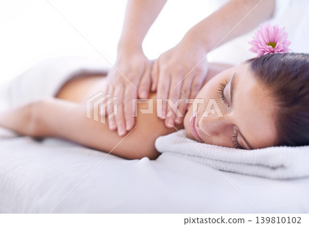 Relax, massage and woman at hotel spa with flower for health, wellness and luxury holistic treatment. Self care, peace and girl on table with masseuse for body therapy, sleep and calm service. Relax, massage and woman at hotel spa with flower for health, wellness and luxury holistic treatment. Self care, peace and girl on table with masseuse for body therapy, sleep and calm service. 139810102