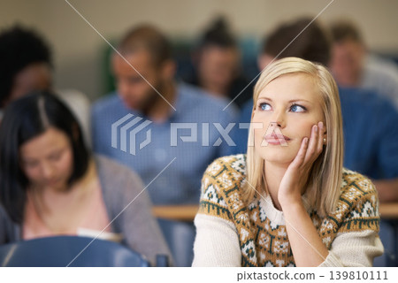 Woman, student and thinking in university lecture hall to prepare, vision and study for exams. Idea, serious and focus on plan for determination, knowledge and information for assessment task 139810111