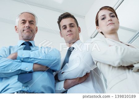 Business people, portrait and confidence for collaboration in office, cooperation and teamwork in workplace. Coworkers, together and pride for company unity, low angle and solidarity by accountants Business people, portrait and confidence for collaboration in office, cooperation and teamwork in workplace. Coworkers, together and pride for company unity, low angle and solidarity by accountants 139810189
