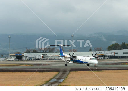 A hazy spring scene at Kumamoto Airport, enveloped in April rain. A hazy spring scene at Kumamoto Airport, enveloped in April rain. 139810439