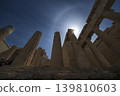 Sunburst over ancient columns at the Acropolis in Athens 139810603