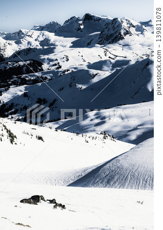 A magnificent winter landscape of a ski resort spread across snow-covered mountains. A magnificent winter landscape of a ski resort spread across snow-covered mountains. 139811078