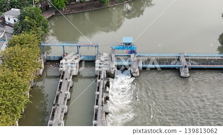 aerial view shows a river dam and water control management system 139813062