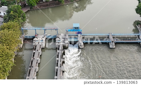 aerial view shows a river dam and water control management system 139813063