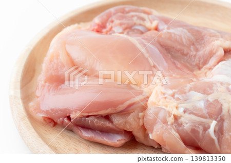 Close-up of raw chicken thighs on a plate Close-up of raw chicken thighs on a plate 139813350