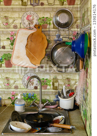 top view of a kitchen sink with dirty dishes top view of a kitchen sink with dirty dishes 139814176