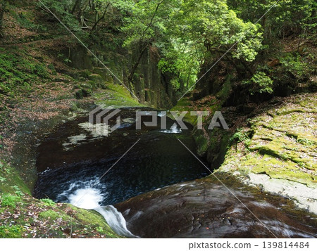 A clear stream flows into a deep green valley. An aerial view of the top of the Akame Forty-Eight Waterfalls, Ryugatubo. A clear stream flows into a deep green valley. An aerial view of the top of the Akame Forty-Eight Waterfalls, Ryugatubo. 139814484