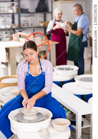 girl works with potter wheel 139815678