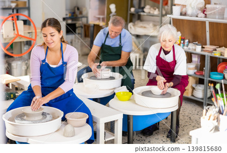 girl works with potter wheel girl works with potter wheel 139815680