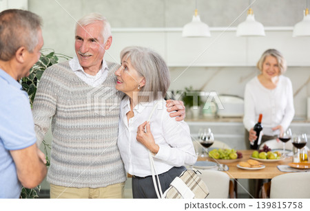 Couple of elderly man and woman greeting friends 139815758