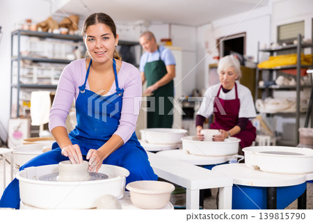 girl works with potter wheel girl works with potter wheel 139815790