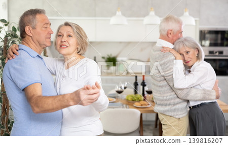 Couple of elderly man and woman dancing in kitchen 139816207