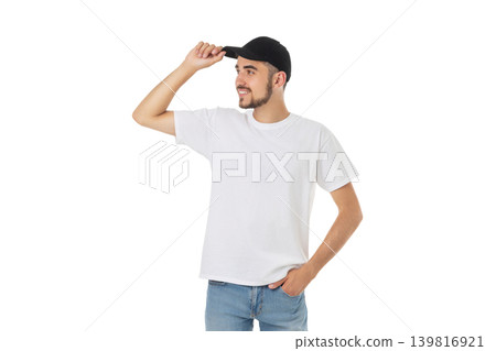 Young man stands holding cap with space for design, PNG Young man stands holding cap with space for design, PNG 139816921