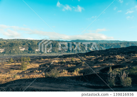 Lava fields and green hills stretch across Kintamani Bali area 139816936