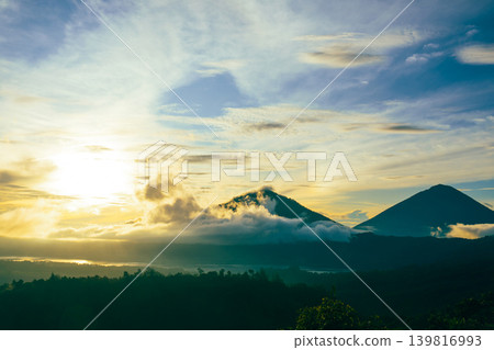 Mountains in Kintamani Bali under a bright sky with clouds Mountains in Kintamani Bali under a bright sky with clouds 139816993
