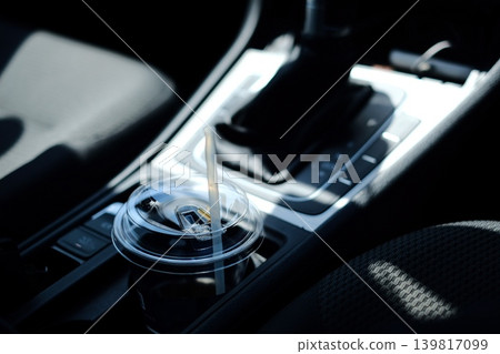 Coffee placed in the drink holder Coffee placed in the drink holder 139817099
