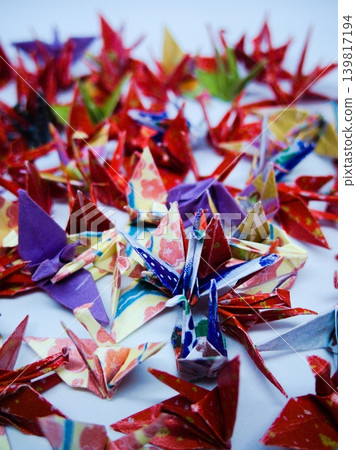 Japanese colors: Many origami cranes folded from chiyogami paper Japanese colors: Many origami cranes folded from chiyogami paper 139817194