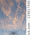 Power transmission towers and power lines at dusk 139817490