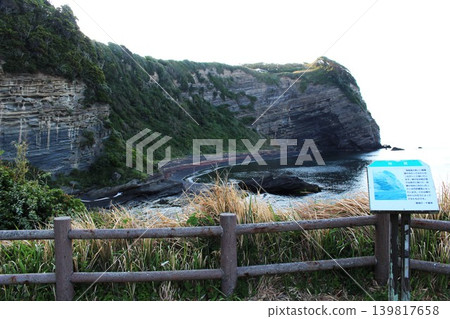 Sea cliffs viewed from the grassy area of Obusa Cape 139817658