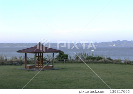 A grassy area by the sea and the scenery of Kagamigaura. A grassy area by the sea and the scenery of Kagamigaura. 139817665
