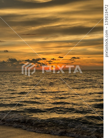 Vertical View Of Golden Sunset Sky Over Sea Waves At Batu Ferringhi Beach Vertical View Of Golden Sunset Sky Over Sea Waves At Batu Ferringhi Beach 139818472