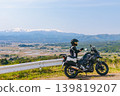Snow-covered Mt. Iide and a motorcycle 139819207