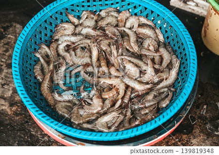 A close up top view of fresh raw tiger shrimp pile displayed at a traditional seafood street market stall in Hoi An ancient town Vietnam 139819348