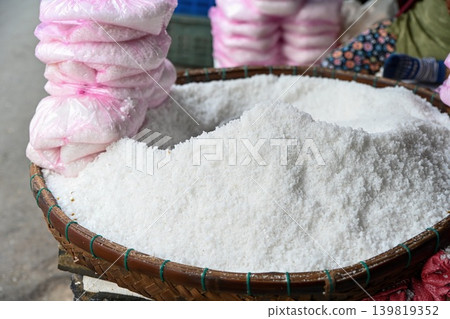 A close up view of natural white sea salt pile displayed at a traditional street market stall in Hoi An ancient town Quang Nam Vietnam A close up view of natural white sea salt pile displayed at a traditional street market stall in Hoi An ancient town Quang Nam Vietnam 139819352