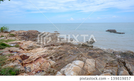 Natural Rocky Shore Intersecting With The Calm Sea Natural Rocky Shore Intersecting With The Calm Sea 139819857
