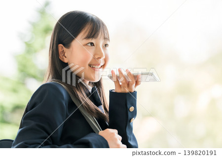 High school students, junior high school students, and elementary school students talking on smartphones and other devices 139820191