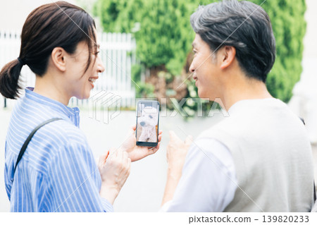 Pets: A pet owner can connect a pet camera to check on their dog while away from home. Pets: A pet owner can connect a pet camera to check on their dog while away from home. 139820233