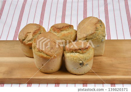 Small Pumpkin Seed Bread Loaves on Wooden Board Small Pumpkin Seed Bread Loaves on Wooden Board 139820371