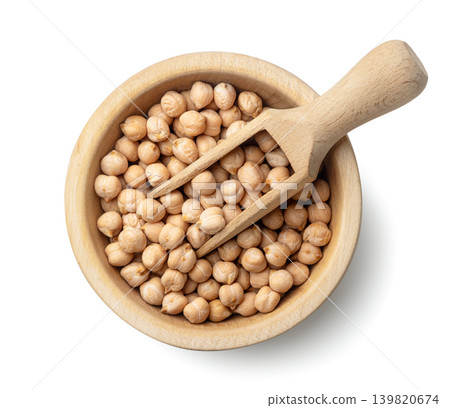 Chickpeas in a wooden bowl with a scoop on a white background. Top view Chickpeas in a wooden bowl with a scoop on a white background. Top view 139820674