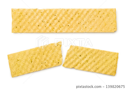 Long potato chip and one broken in half close-up on a white background. Top view Long potato chip and one broken in half close-up on a white background. Top view 139820675