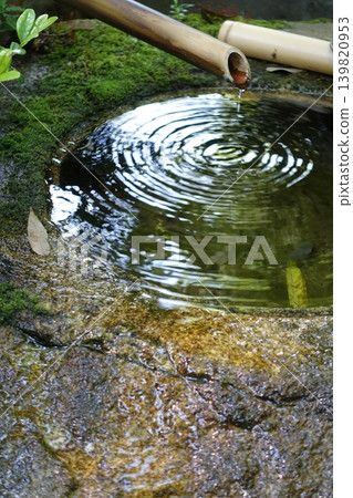 Ripples spreading across the surface of the water in the washbasin Ripples spreading across the surface of the water in the washbasin 139820953