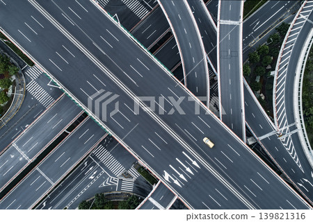 Aerial photograph capturing a complex network of intersecting highway junctions from directly above. Aerial photograph capturing a complex network of intersecting highway junctions from directly above. 139821316