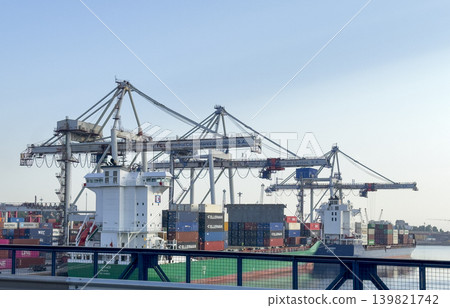 Porto Portugal May 20 2025 Cargo containers at seaport terminal with cranes and shipping vessels. 139821742