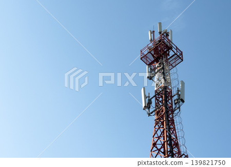 Telecom tower with antennae against blue sky. Wireless communication network infrastructure for 139821750