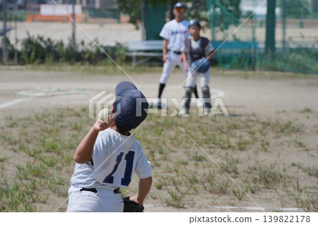 A young baseball player who is working hard to become a professional baseball player A young baseball player who is working hard to become a professional baseball player 139822178